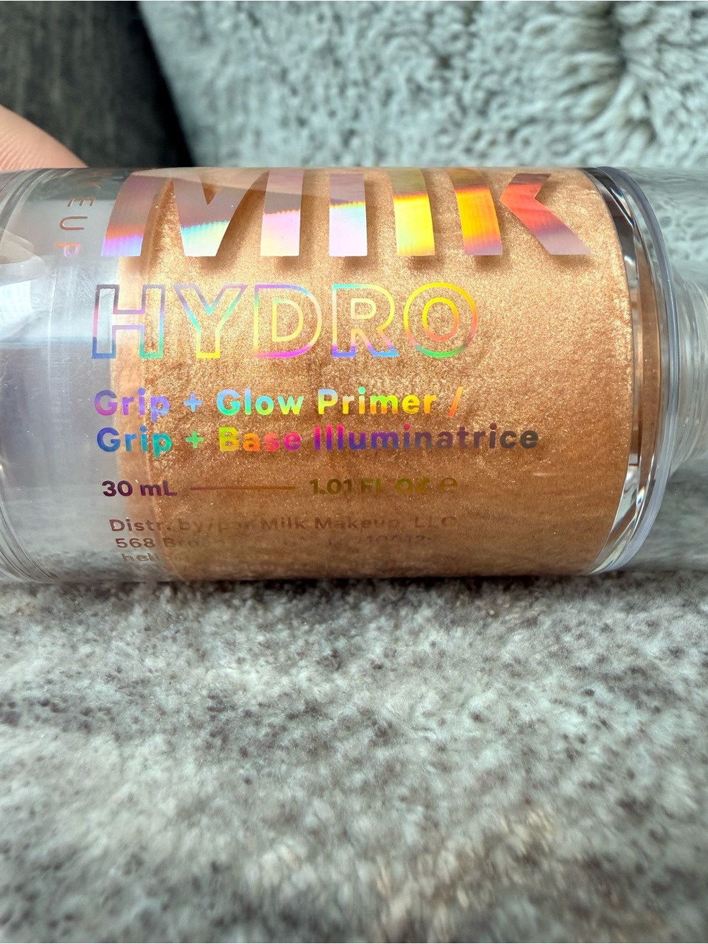 Milk Makeup Hydro Grip + Glow Primer — shimmering gold
